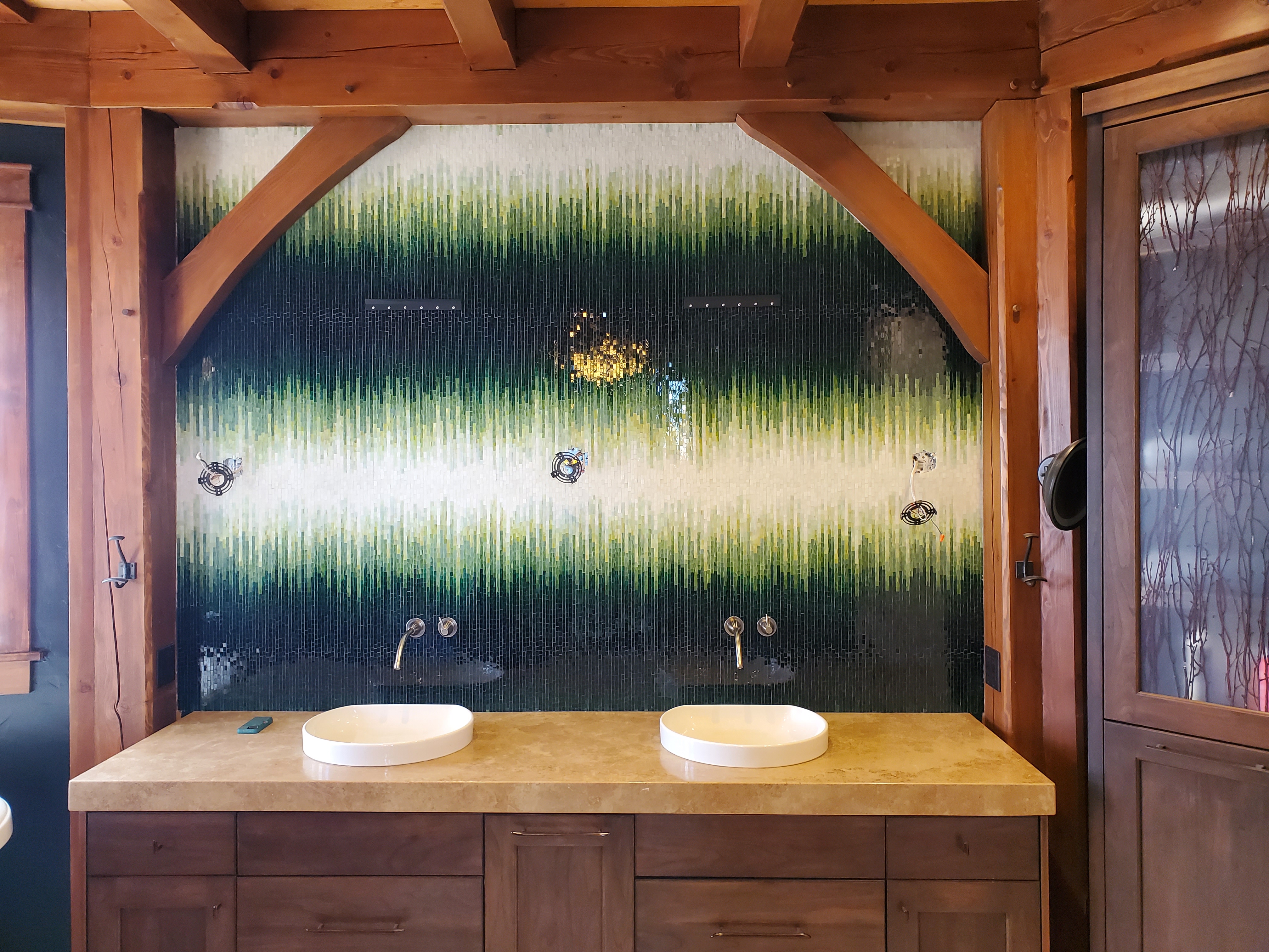 Green to white gradient geometric vanity splash with translucent grout