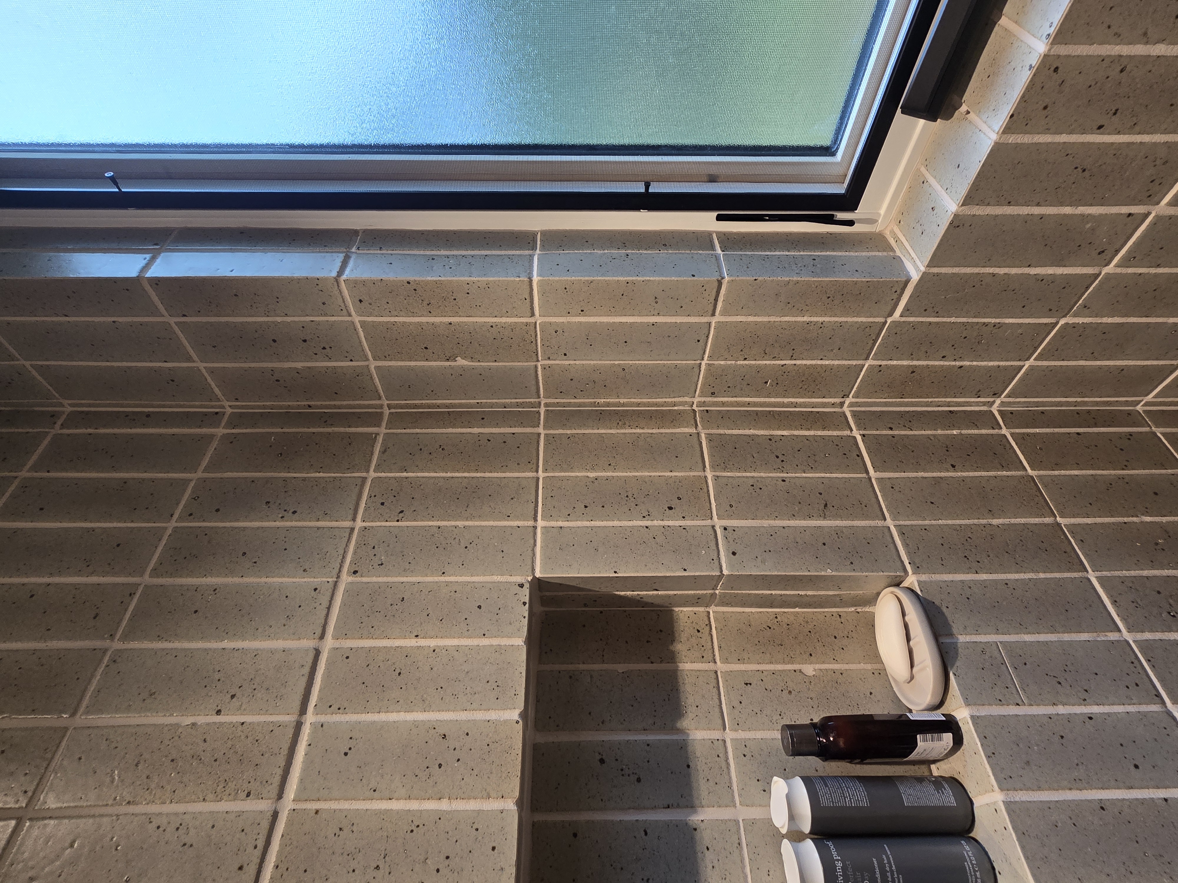 Master bath shower area with artisan tile and precision outside corner miters