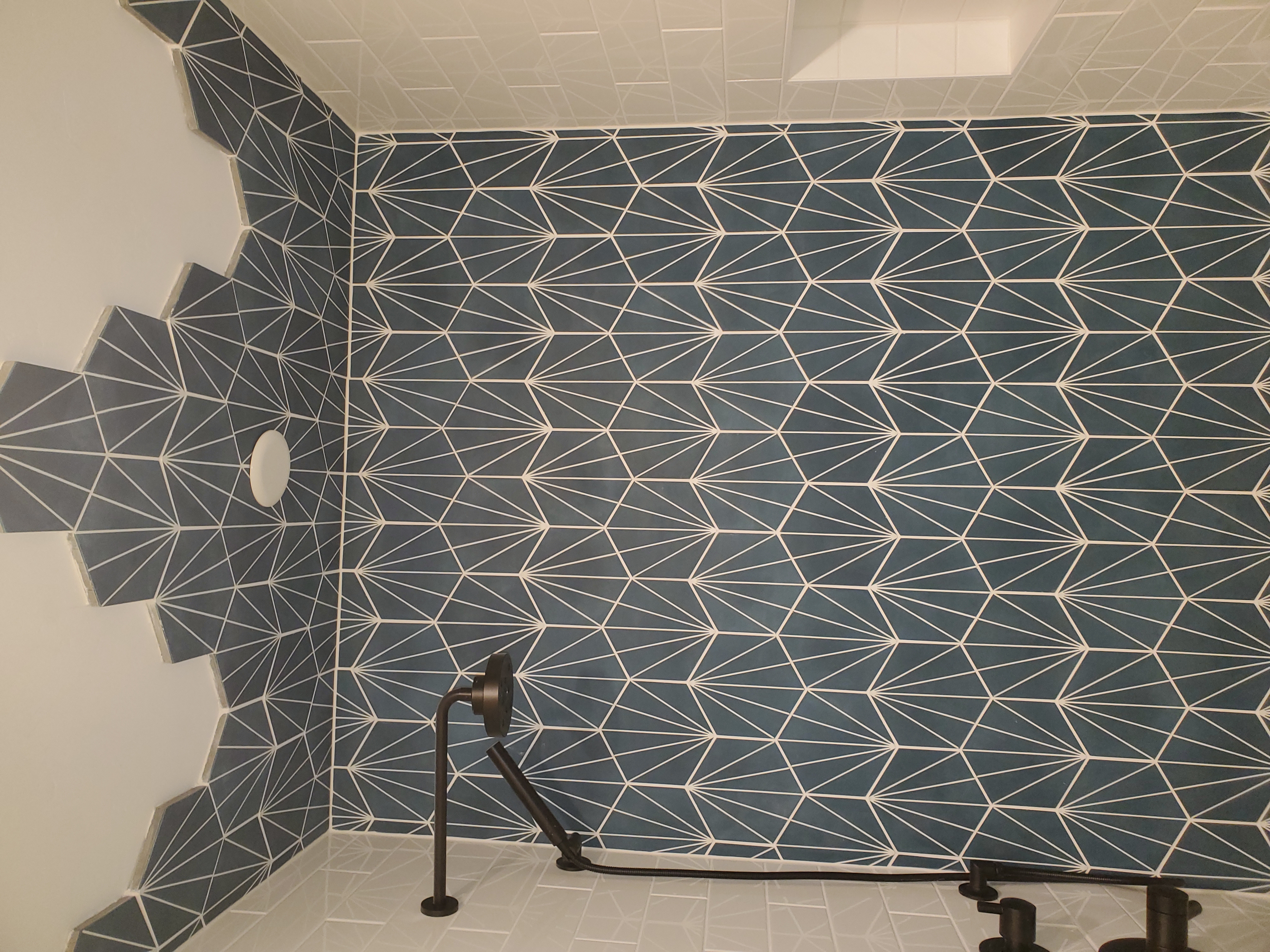 Custom gradient mosaic tile mural book matched from back wall to ceiling in timber frame bathroom