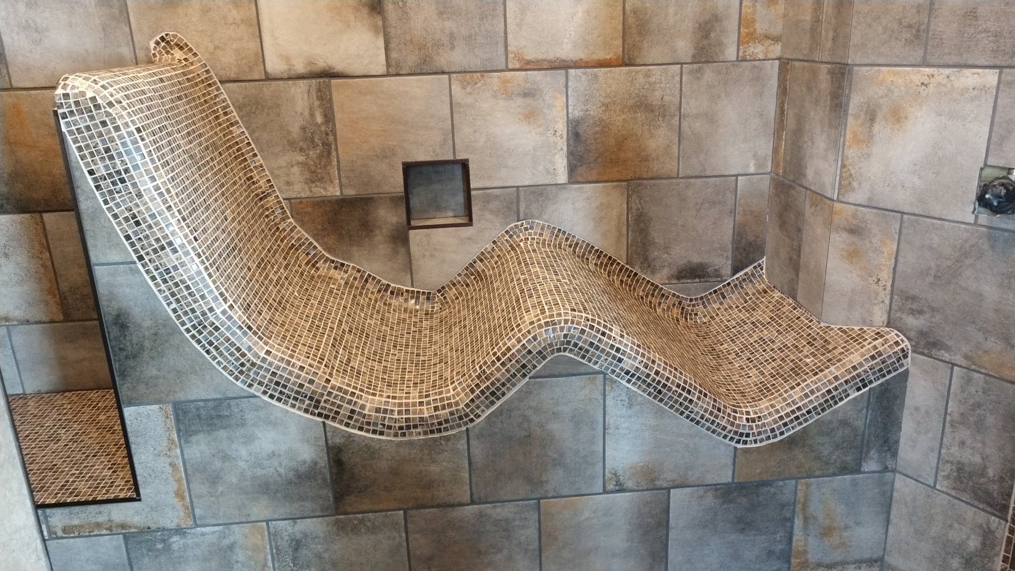 Finished mosaic tile custom shower recliner lounge